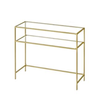 A gold and glass console table