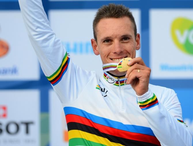 Philippe Gilbert (Belgium) checks how gold his gold medal really is