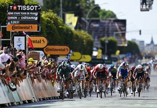 CHATEAUROUX, FRANCE - JULY 13: (L-R) Jonathan Milan of Italy and Team Lidl - Trek - Polka dot Mountain Jersey, Tim Merlier of Belgium and Team Soudal Quick-Step and Arnaud De Lie of Belgium and Team Lotto sprint at finish line during the 112th Tour de France 2025, Stage 9 a 174.1km stage from Chinon to Chateauroux ) / #UCIWT / on July 13, 2025 in Chateauroux, France.