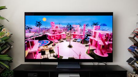 Samsung S90F OLED TV on a cabinet