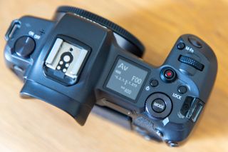 Top-down view of the Canon EOS R, say on a wooden surface