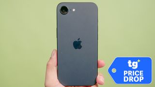 iPhone 16e held in hand shown from rear