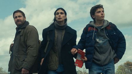 Gerard Butler as John Garrity, Morena Baccarin as Allison Garrity, and Roman Griffin Davis as Nathan Garrity in Greenland 2: Migration.