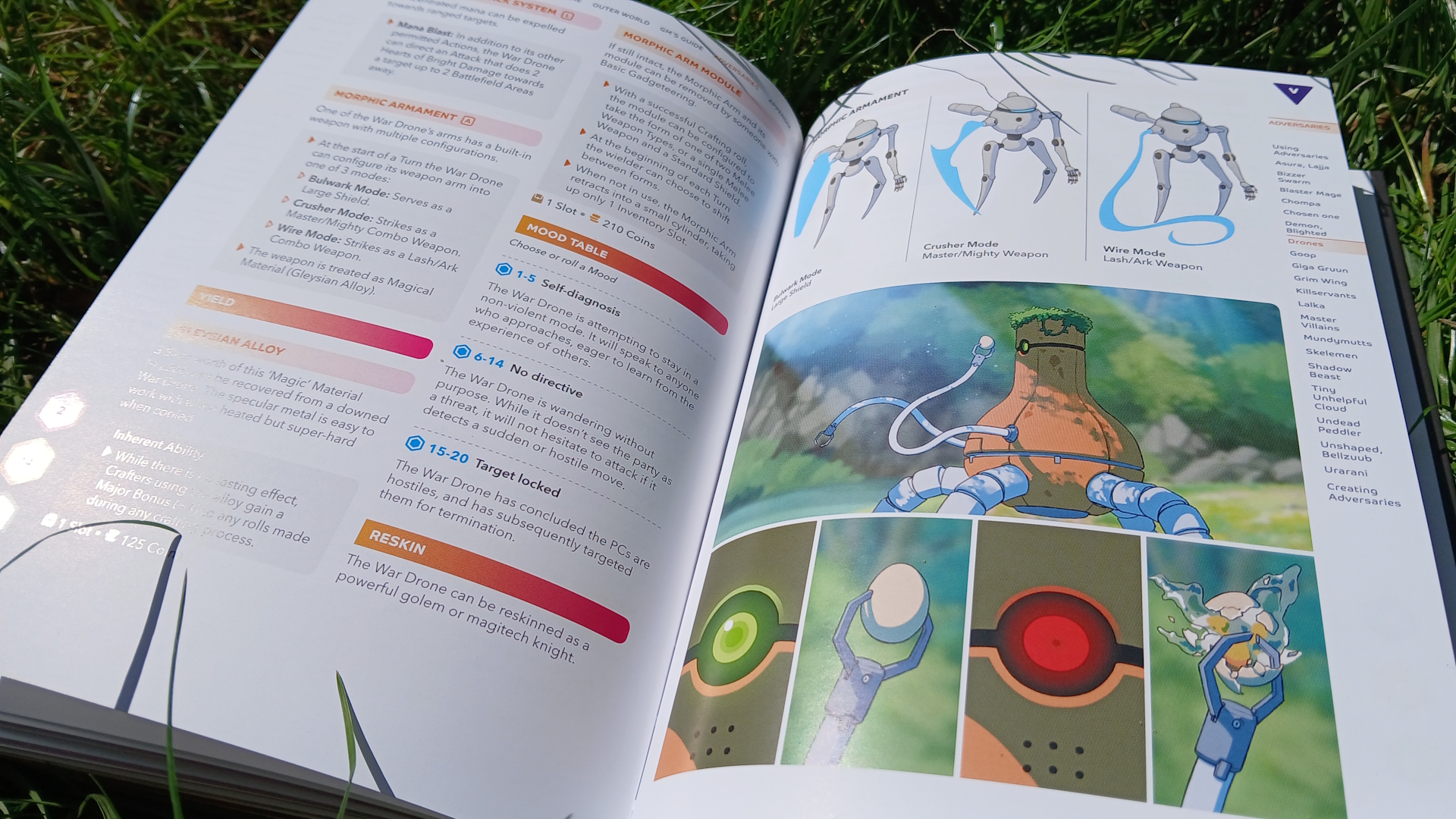 Open Break!! rulebook on a patch of grass, showing robots in a lush environment