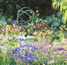 colourful garden with sculpture
