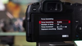 An image showing the Focus Bracketing menu on the back of a Canon EOS RP. Focus Bracketing has been set to Enable and the number of shots has been set to 20.