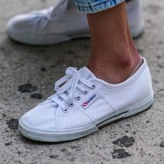 a woman wearing the Superga 2750 Cotu Classic Sneakers