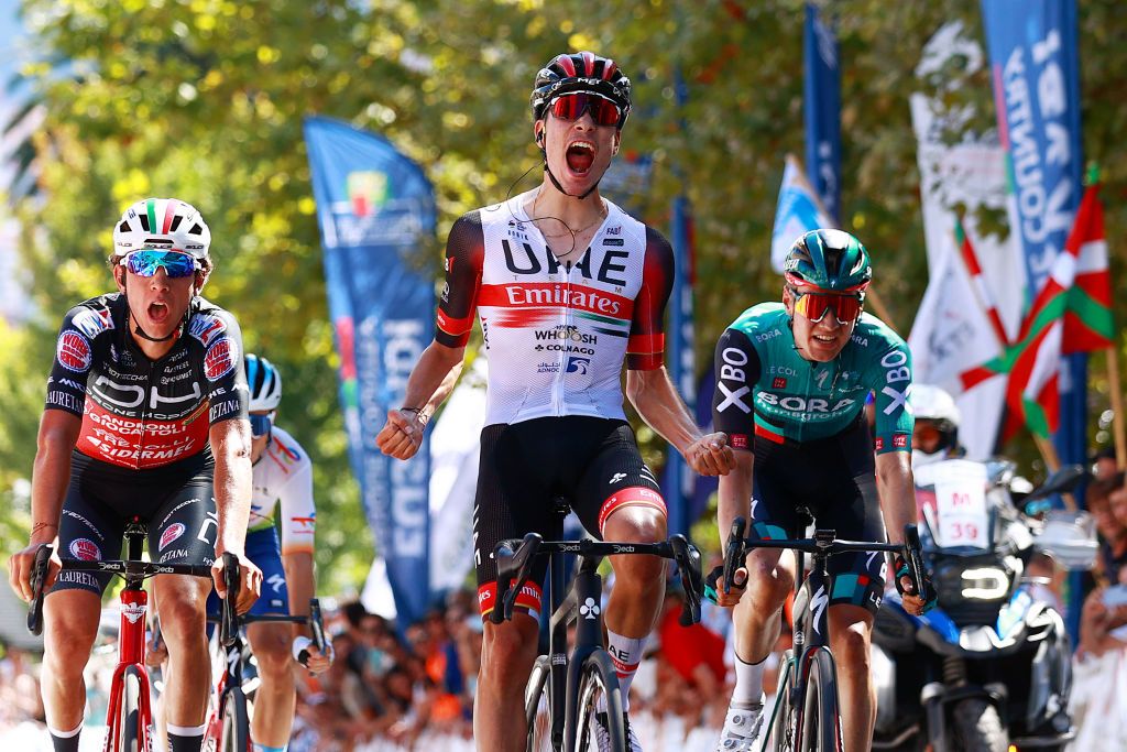 GETXO SPAIN JULY 31 Juan Ayuso Pesquera of Spain and UAE Team Emirates celebrates at finish line as stage winner ahead of Andrea Piccolo of Italy and Team Drone Hopper Androni Giocattoli Sidermec and Wilco Kelderman of Netherlands and Team Bora Hansgrohe during the 77th Circuito de Getxo Memorial Hermanos Otxoa 2022 a 1965km one day race from Bilbao to Getxo 60m Getxokirolak on July 31 2022 in Getxo Spain Photo by Gonzalo Arroyo MorenoGetty Images