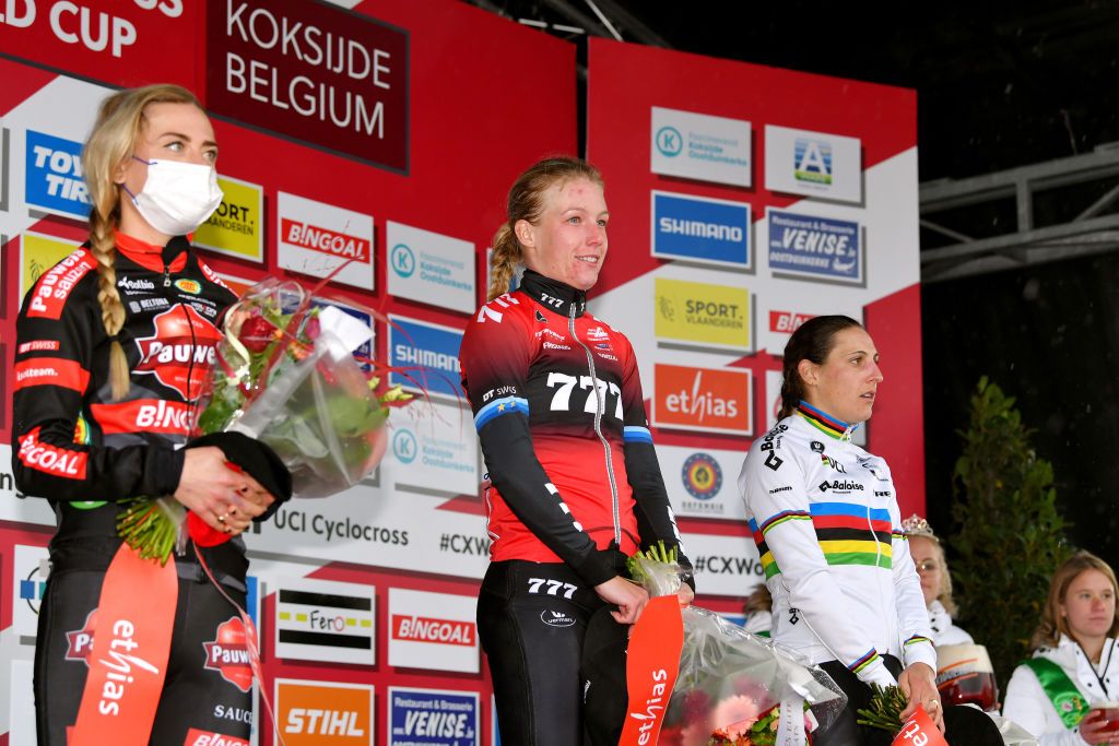 KOKSIJDE BELGIUM NOVEMBER 21 LR Denise Betsema of The Netherlands and Team Pauwels Sauzen Bingoal on second place race winner Annemarie Worst of The Netherlands and Team 777 and Lucinda Brand of The Netherland and Team Baloise Trek Lions on third place pose during the podium ceremony after the 50th Koksijde UCI CycloCross Worldcup 2021 Womens Elite CXWorldCup on November 21 2021 in Koksijde Belgium Photo by Luc ClaessenGetty Images