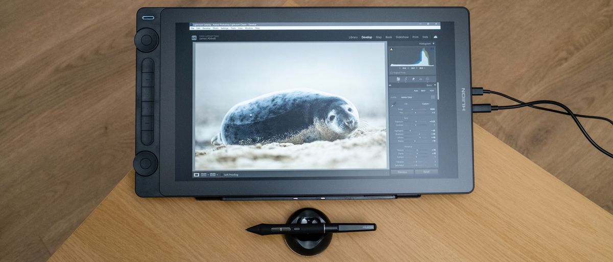 Huion Kamvas 16 (Gen 3) drawing tablet on a wooden desk