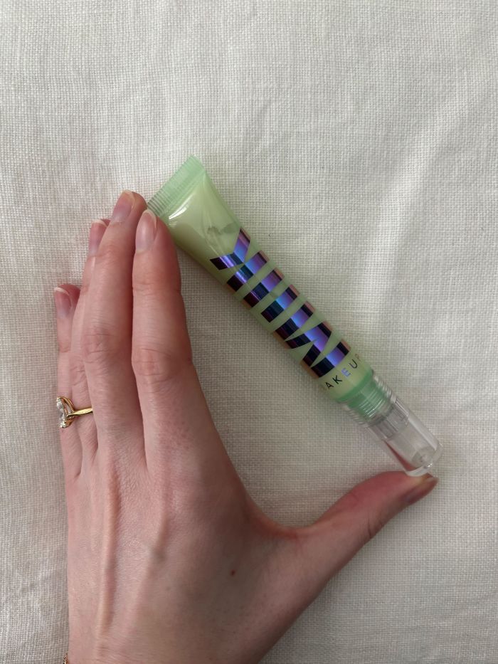 Deputy beauty editor Grace Lindsay holding the Milk Makeup Hydro Grip Eye Primer