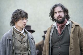 Tom Sweet as younger Pip with Owen McDonnell as Joe Gargery the blacksmith.