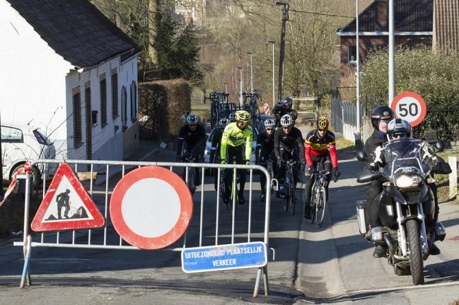Belgian champion Tom Boonen leads his teammates around a barrier during Omloop Het Nieuwsblad course recon.