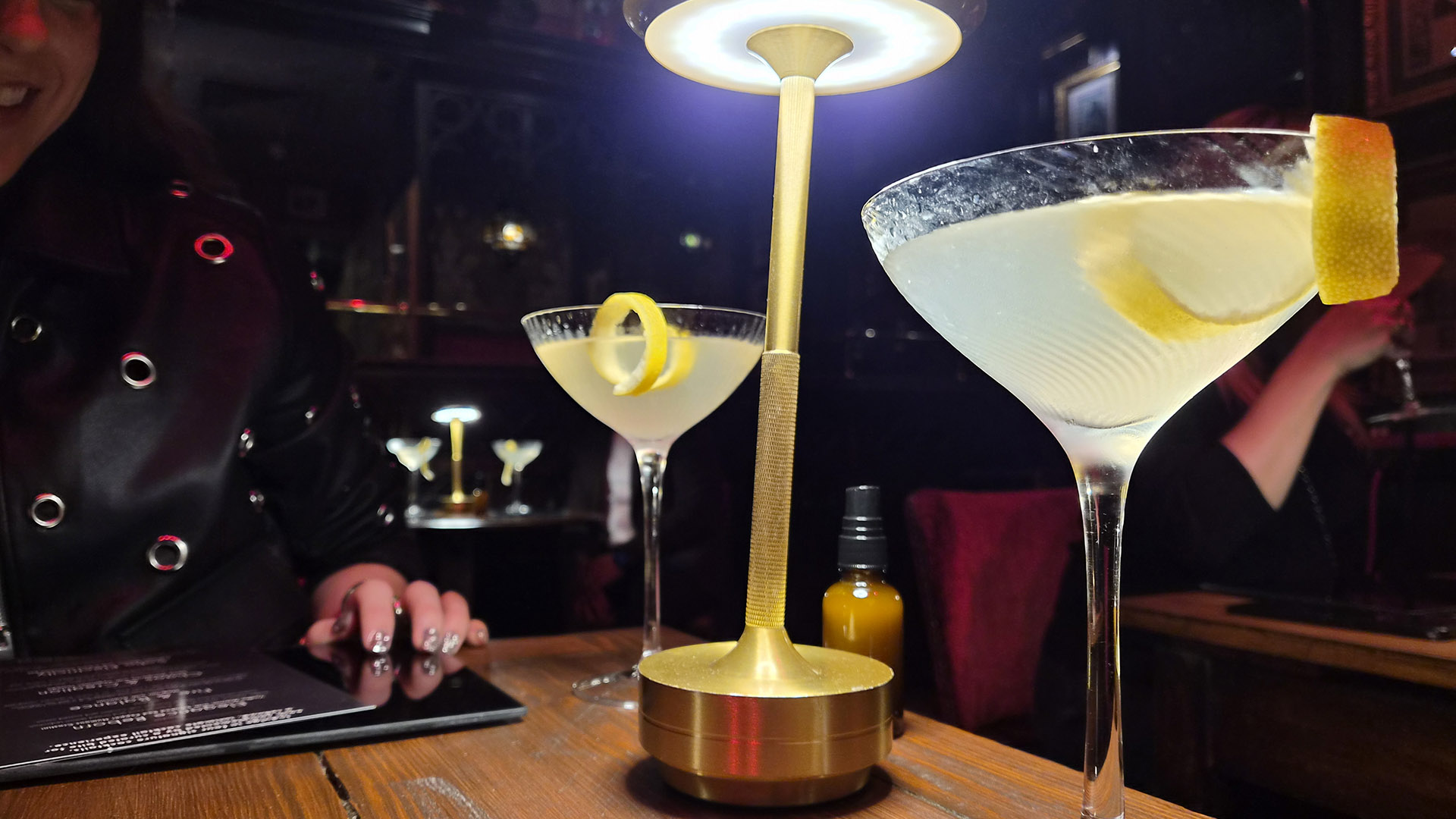 A photo of two cocktail glasses.