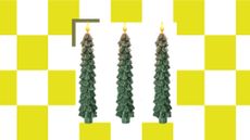 A white and yellow checkerboard background with a white product box square in the middle that has three forest green Christmas tree-shaped LED candles in it.