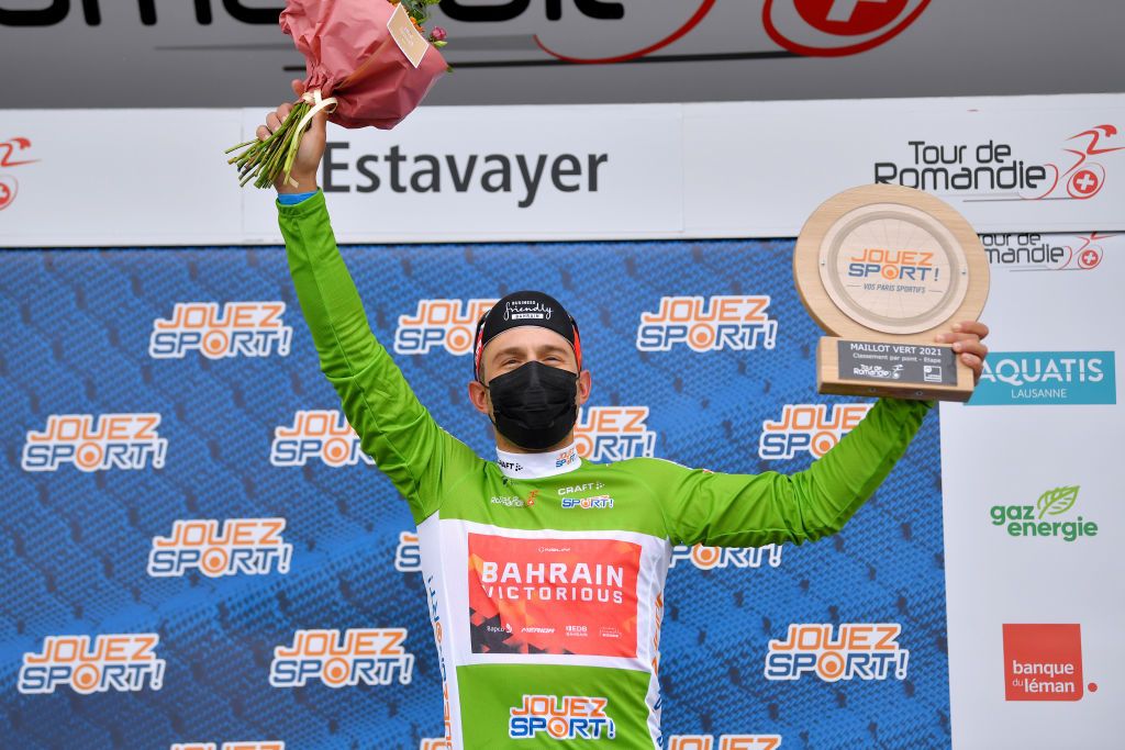 ESTAVAYER SWITZERLAND APRIL 30 Sonny Colbrelli of Italy and Team Bahrain Victorious Green Points Jersey celebrates at podium during the 74th Tour De Romandie 2021 Stage 3 a 1687km stage from Estavayer to Estavayer Mask Covid Safety Measures Trophy TDR2021 TDRnonstop UCIworldtour on April 30 2021 in Estavayer Switzerland Photo by Luc ClaessenGetty Images