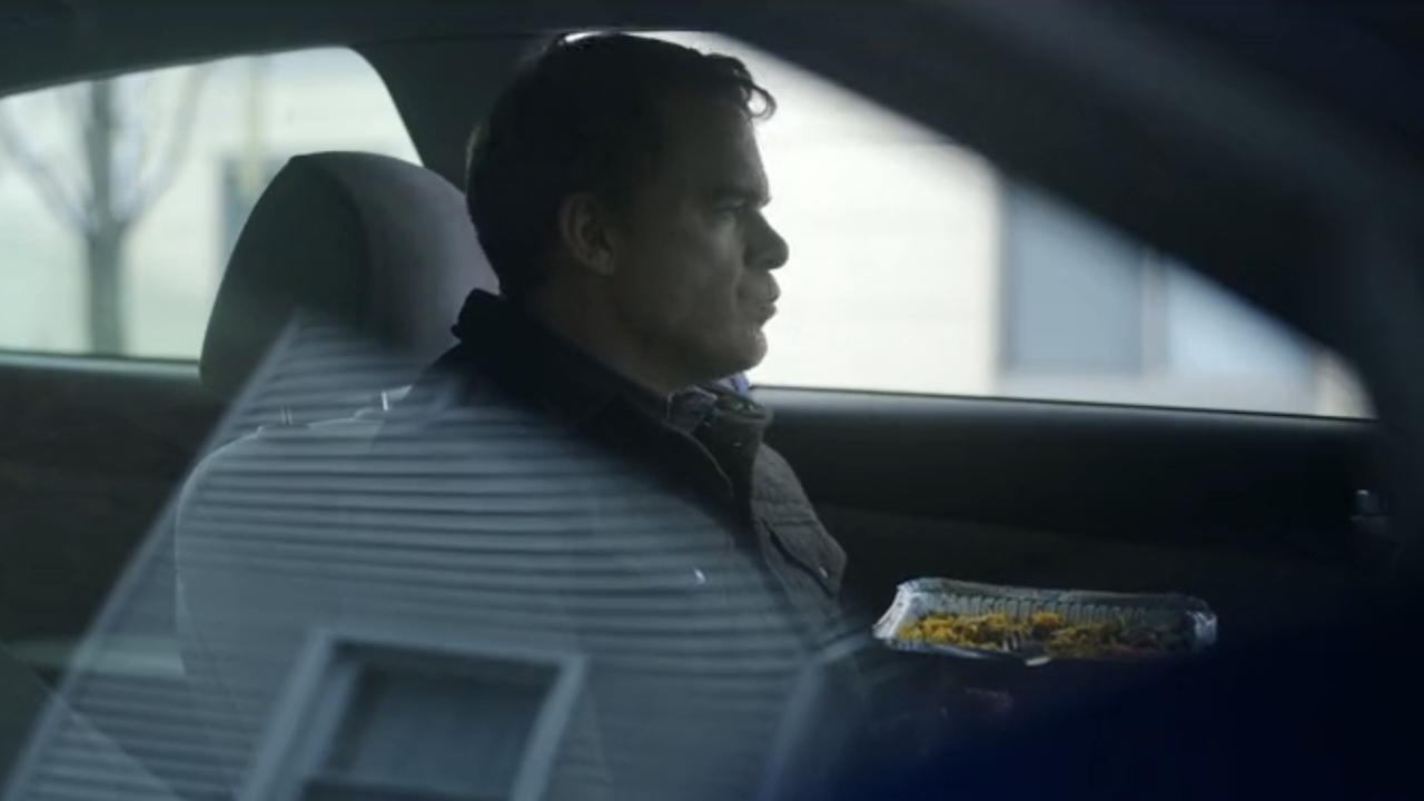 Dexter eating inside his car during stakeout in Dexter: Resurrection Episode 8
