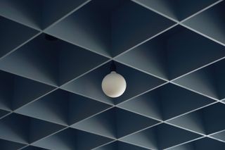 blue grid ceiling in converted London post office designed by Child Studio for Maido Sushi