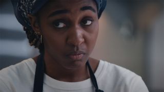 A close up of Sydney staring at someone off-camera in The Bear season 4