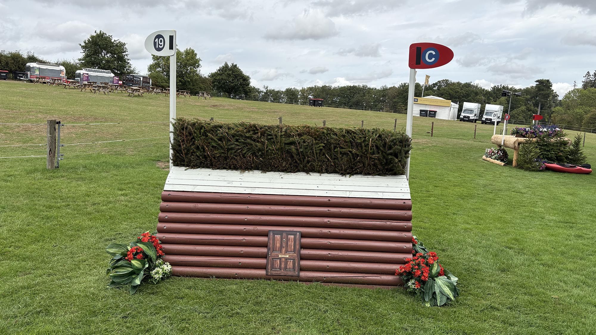 Narrow fence topped with brush on the Burghley cross-country course 2026