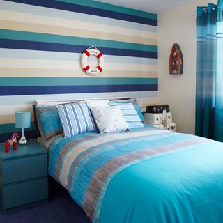 childrens room with nautical striped wallpaper