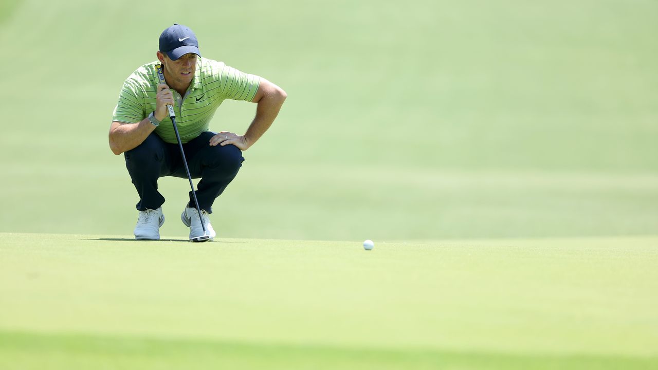 Rory McIlroy lines up a putt