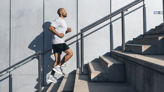 a photo of a man running up stairs