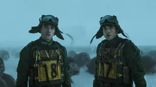 Two clones of a man (Robert Pattinson) stands in a snowy landscape, in the sci-fi movie 'Mickey 17.'