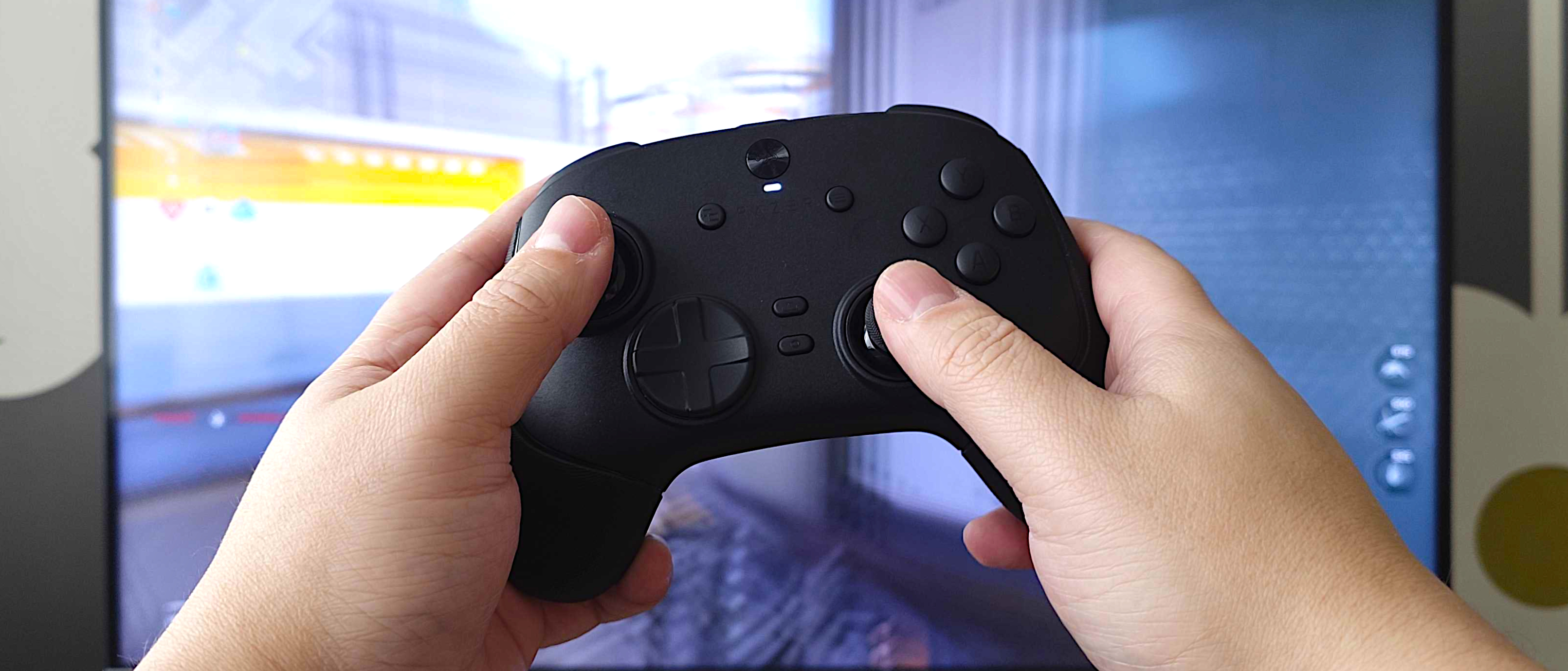 Razer Wolverine V3 Pro 8K PC controller in hand with Call of Duty: Black Ops 7 in the background