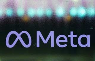Meta Platforms purple logo on black sign