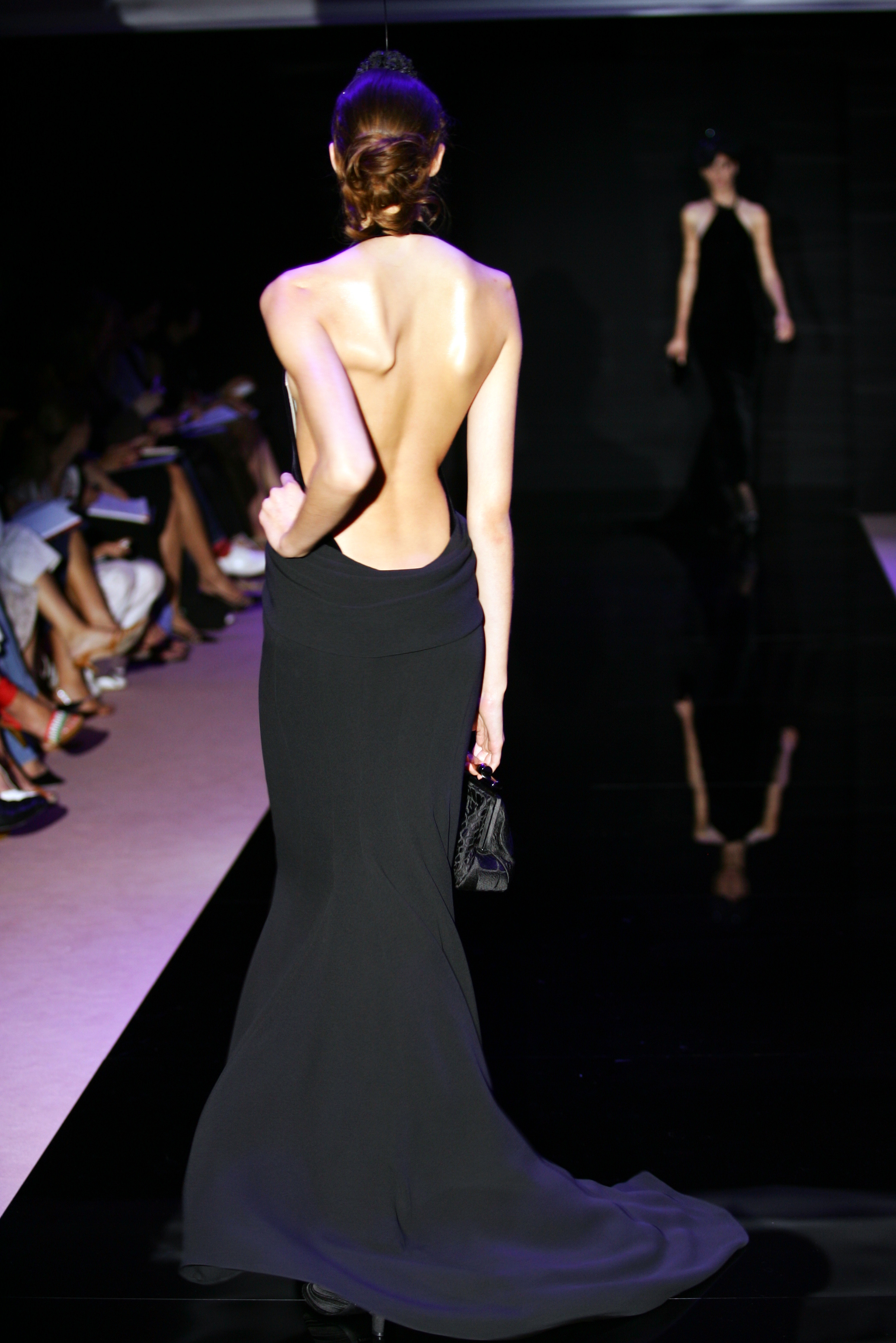 Australian model Alexandra Agoston walks the runway during the Armani Prive Haute Couture Fall Winter 2005-2006 fashion show as part of the Paris Haute Couture Fashion Week on July 6, 2005