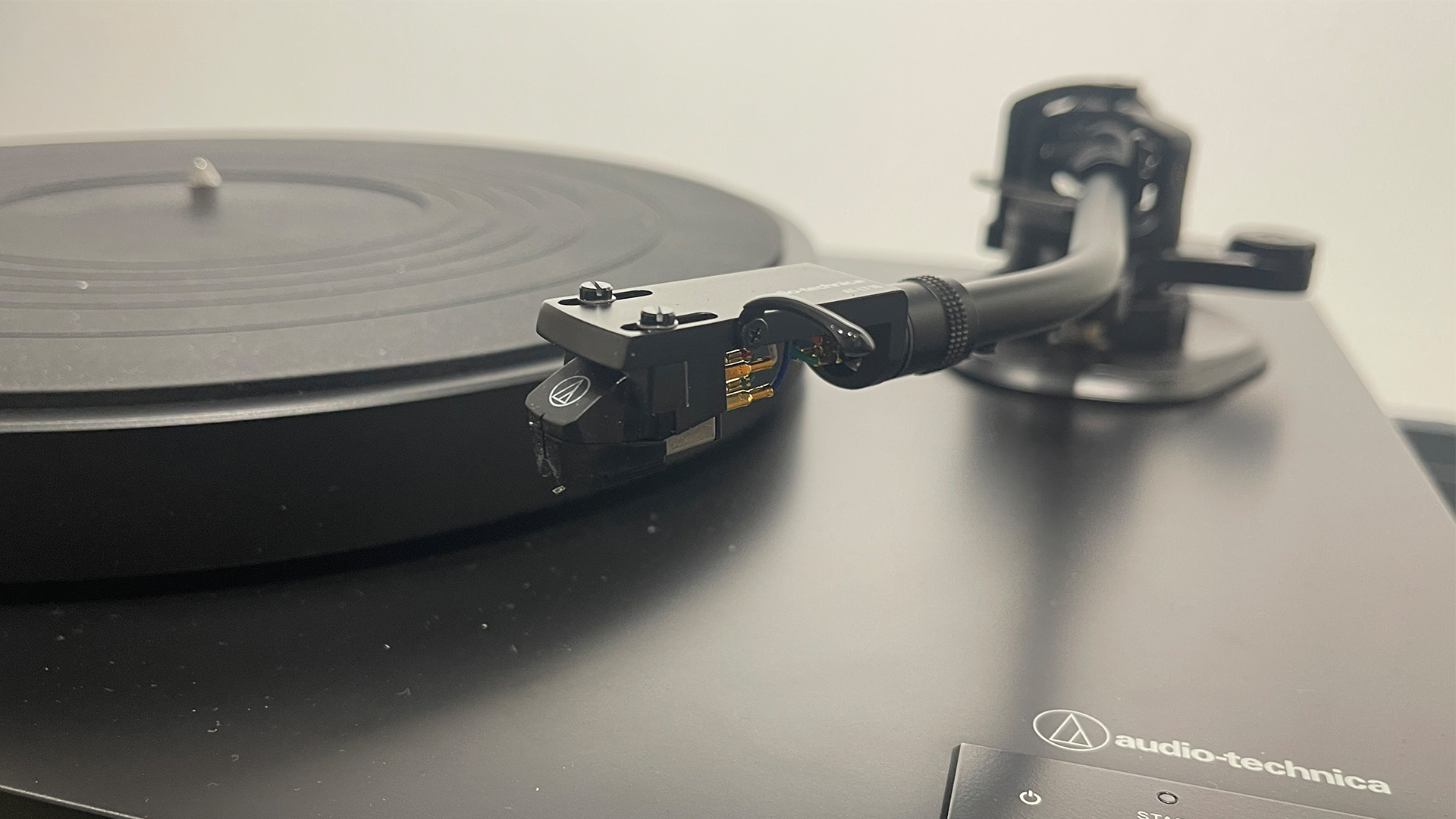 Audio-Technica AT-LP8X turntable front view showing tonearm and platter