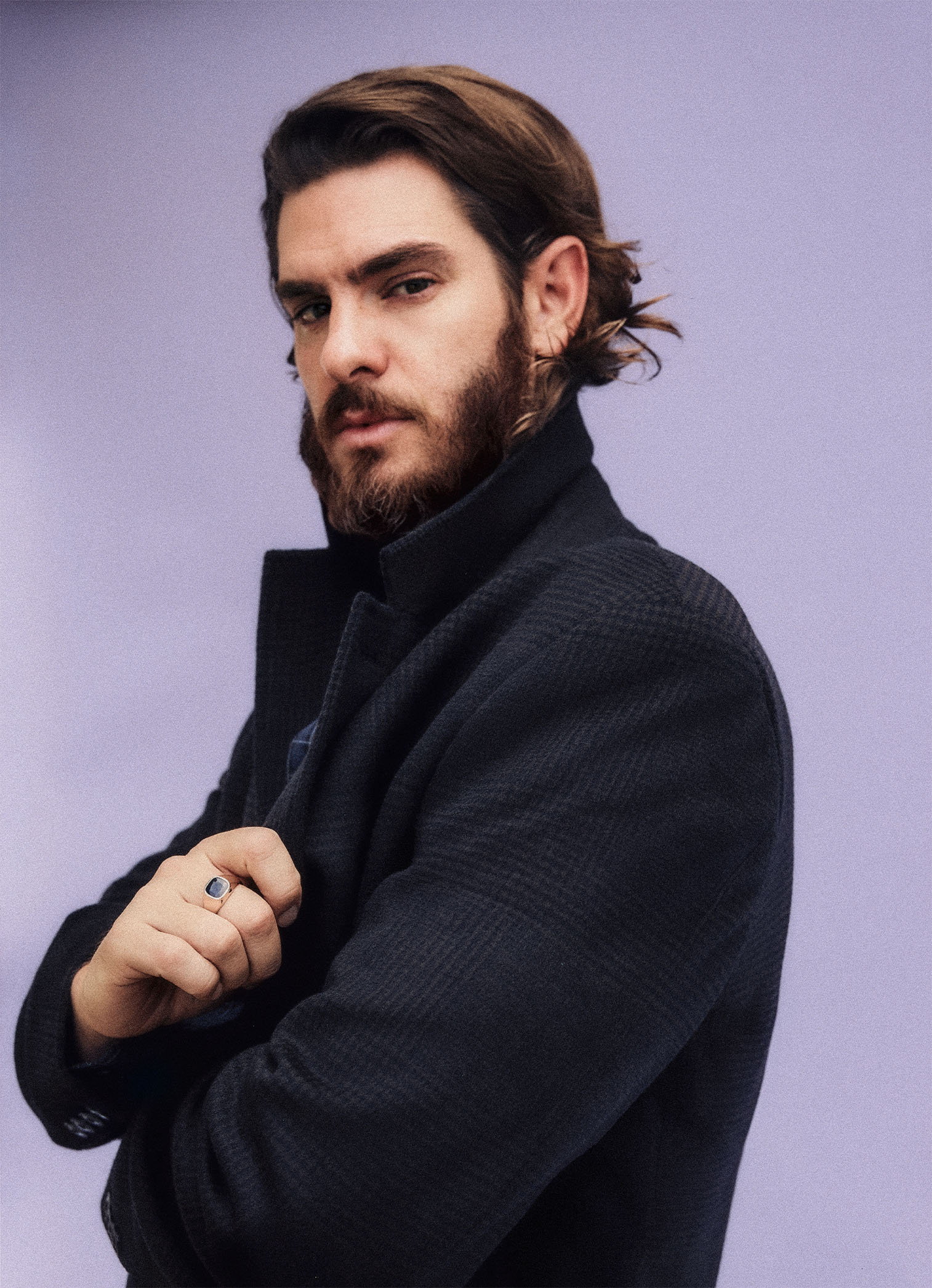 Andrew Garfield for Who What Wear's September cover wearing a dark jacket with a popped collar.