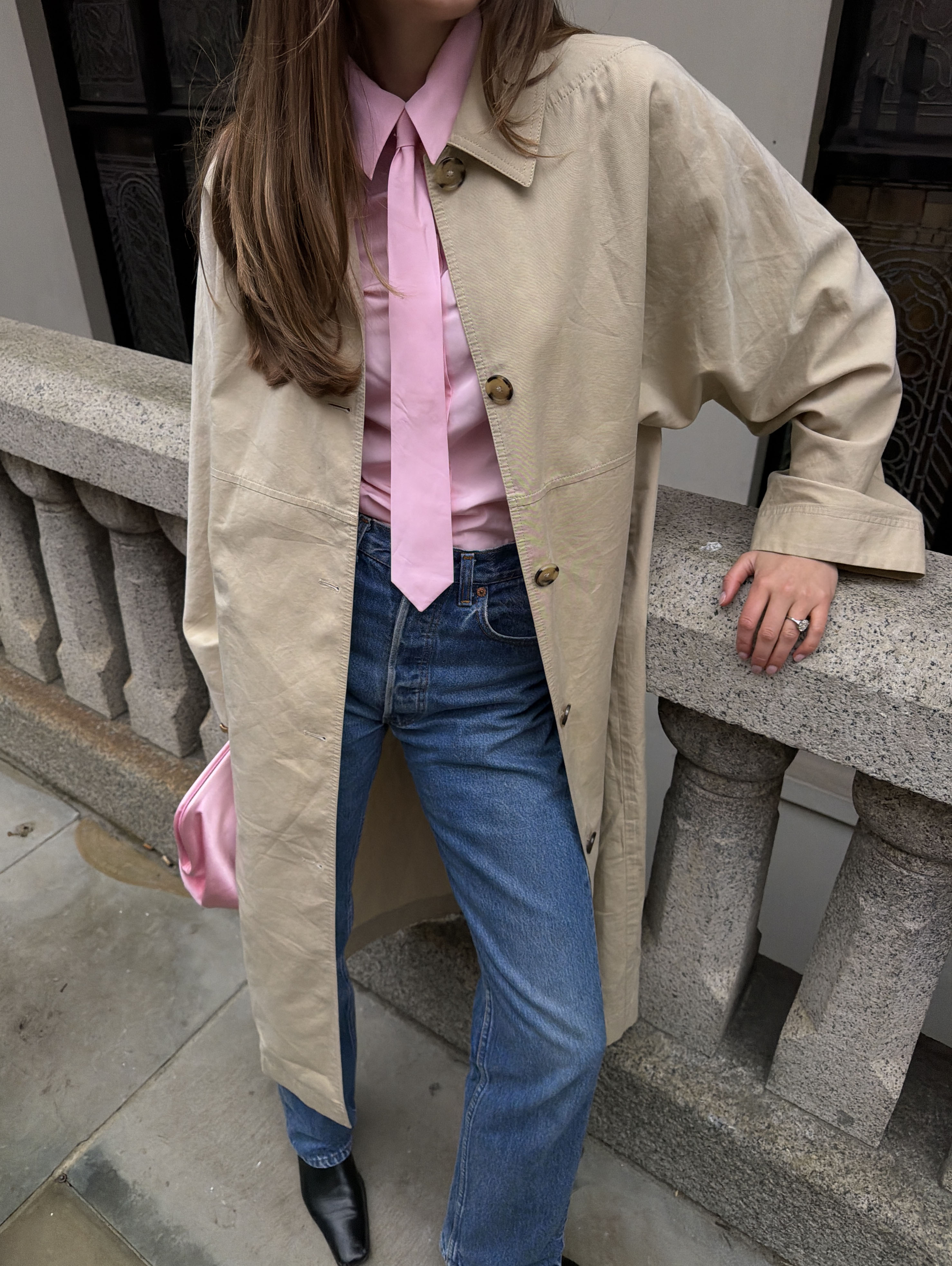 Woman in pink shirt and jeans