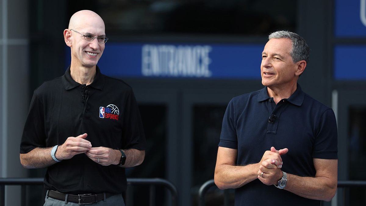 NBA Commissioner Adam Silver, left, and Disney chairman and CEO Robert Alan &quot;Bob&quot; Iger on stage during the opening day for NBA Experience, a basketball-driven interactive attraction at Disney Springs, in Orlando, Fla., on August 12, 2019