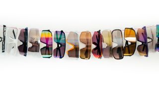 A string of sunglasses hung on a line