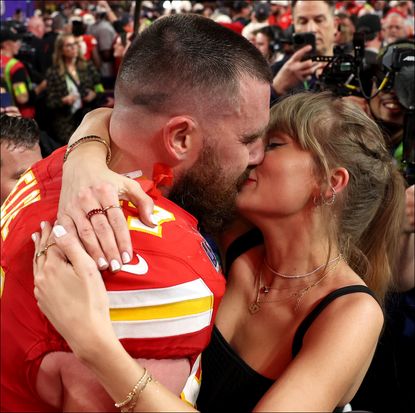  Travis Kelce #87 of the Kansas City Chiefs and Taylor Swift embrace after defeating the San Francisco 49ers in overtime during Super Bowl LVIII at Allegiant Stadium on February 11, 2024.
