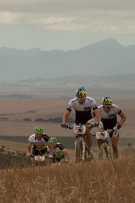 Jose Hermida and Rudi van Hout of Team Multivan Merida Biking prepare to pass Tim Boehme and Simon Stiebjahn of Team Bulls 2