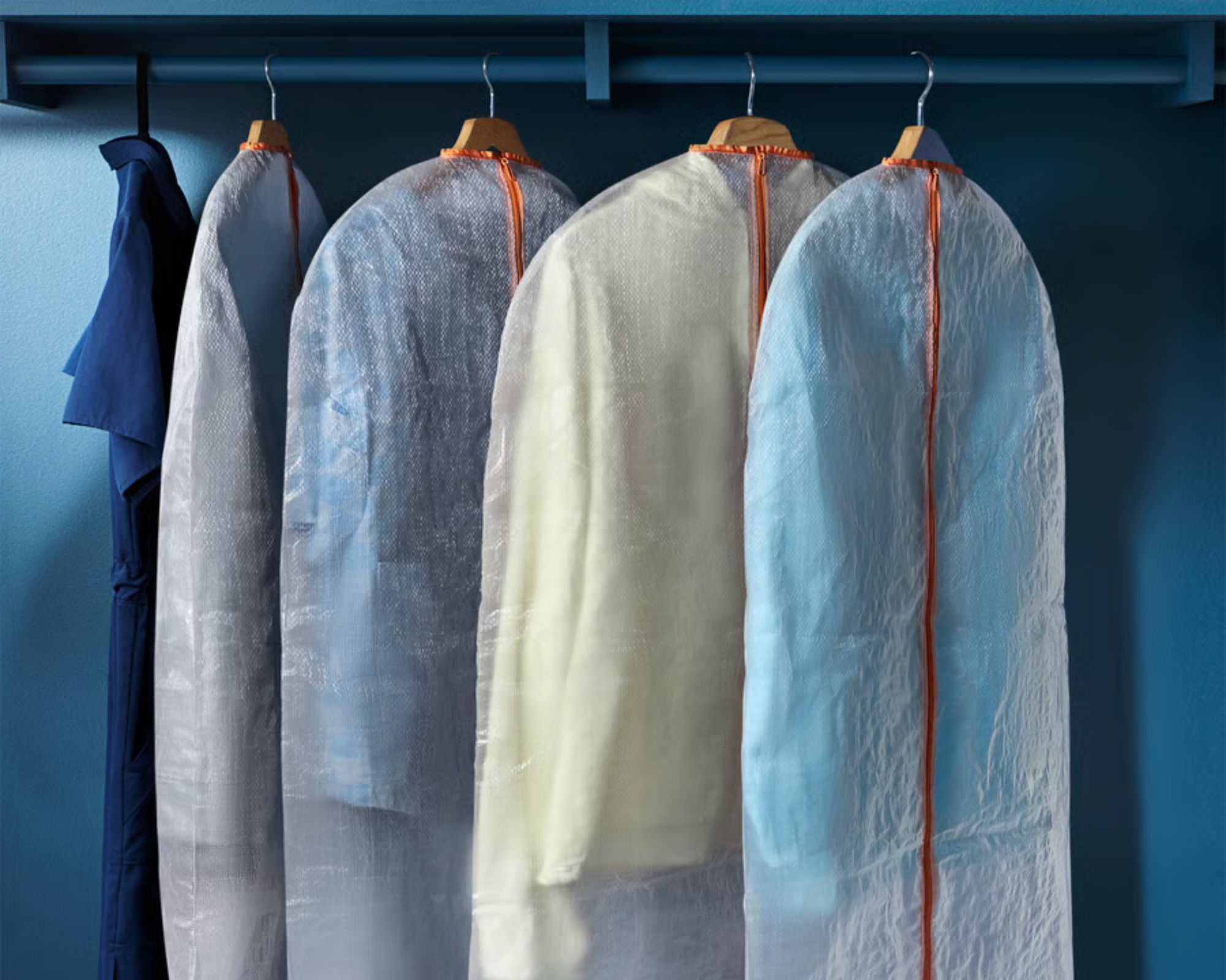 IKEA P&amp;Auml;RKLA Clothes covers being used in a blue closet with matching blue rail