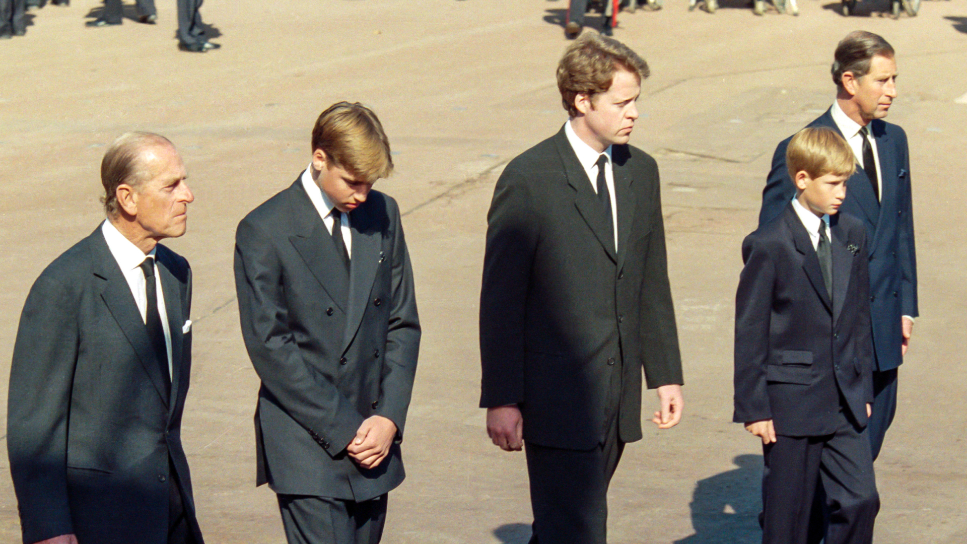 Prince Philip, Prince William, Earl Charles Spencer, Prince Harry, and King Charles walk together behind the carriage carrying the casket of Princess Diana on its way to the funeral