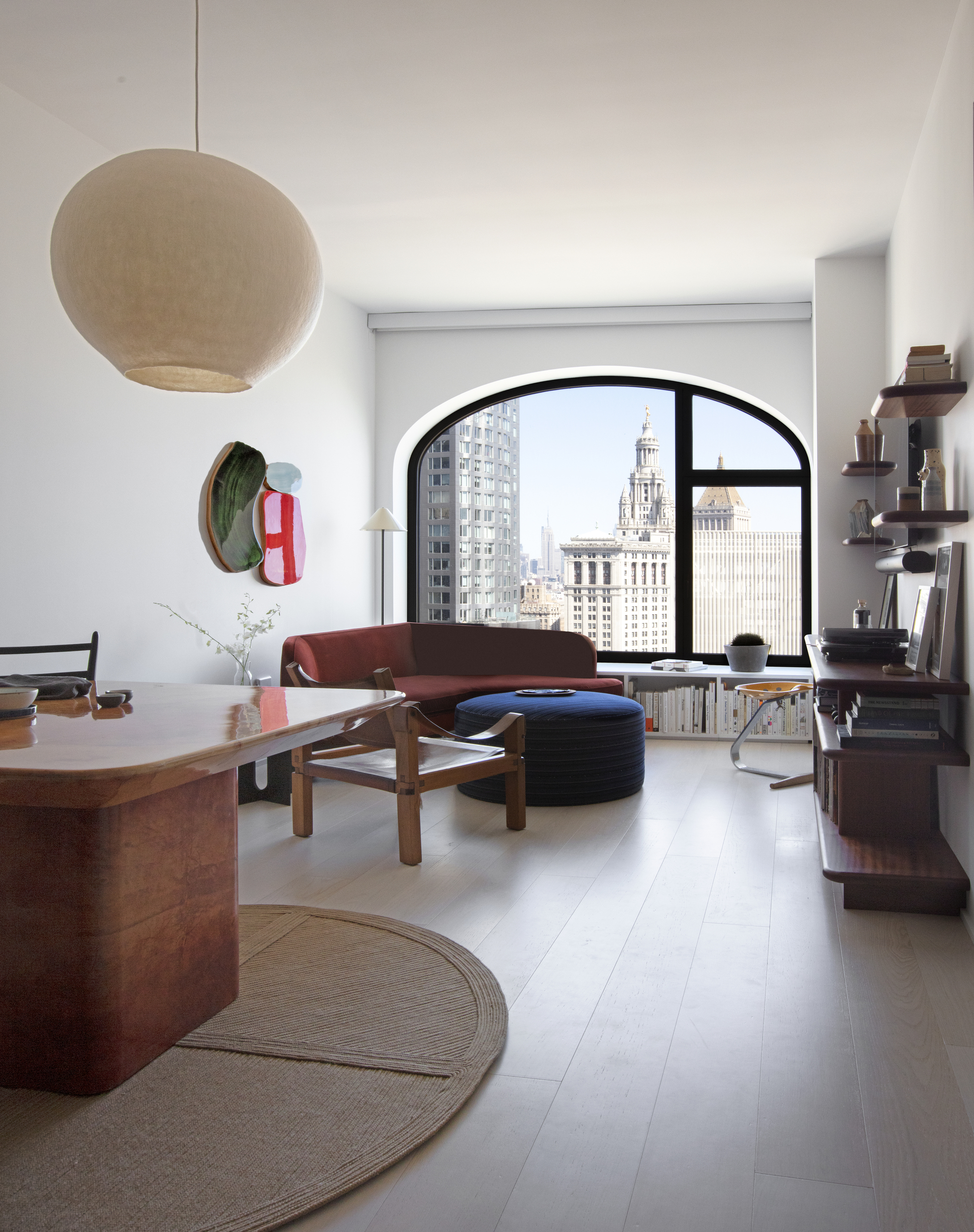 A large living room with an arched window