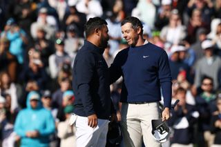 JJ Spaun and Rory McIlroy shake hands on the 18th green