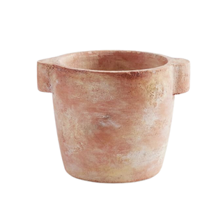 A distressed terracotta planter 
