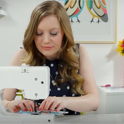 lady with white sewing machine on white desk