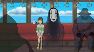 A still from Spirited Away in which Chihiro and a spirit called No Face sit on a train