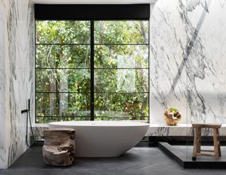 marble master bathroom in Jae Omar home in California