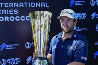 Ben Campbell holds up the International Series Morocco trophy in 2024