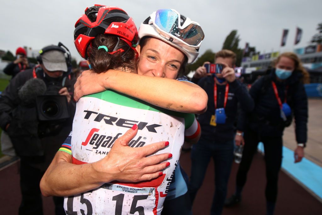 Lizzie Deignan and Elisa Longo Borghini celebrating placing first and third at Paris-Roubaix Femmes 2021