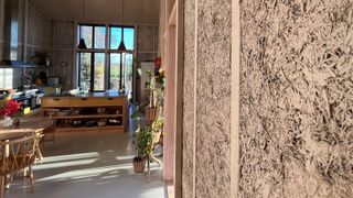 Hemp insulation seen exposed in the walls of a kitchen