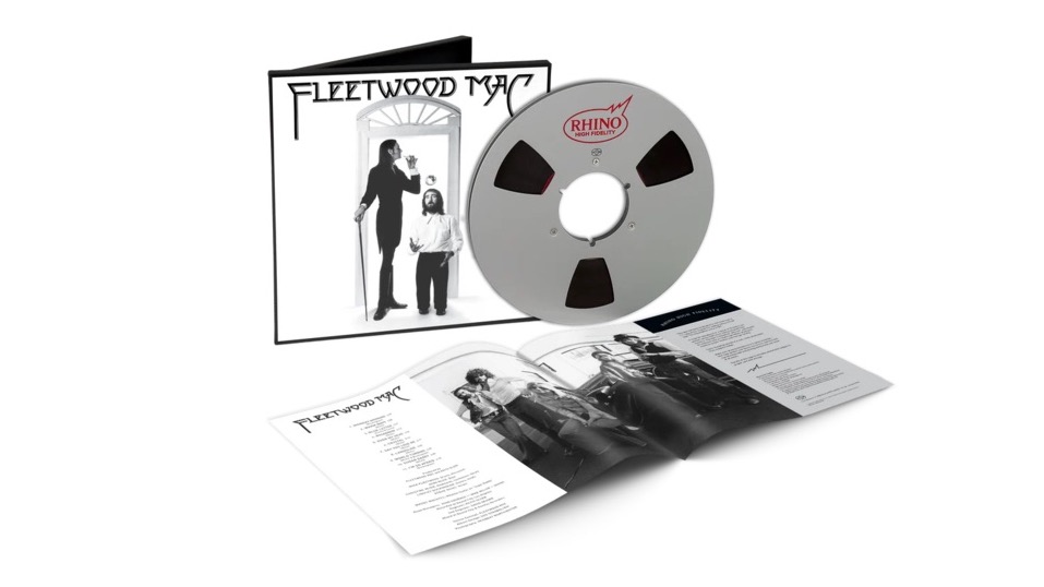 A reel-to-reel tape of the album Fleetwood Mac with its packaging and a booklet on a white background.